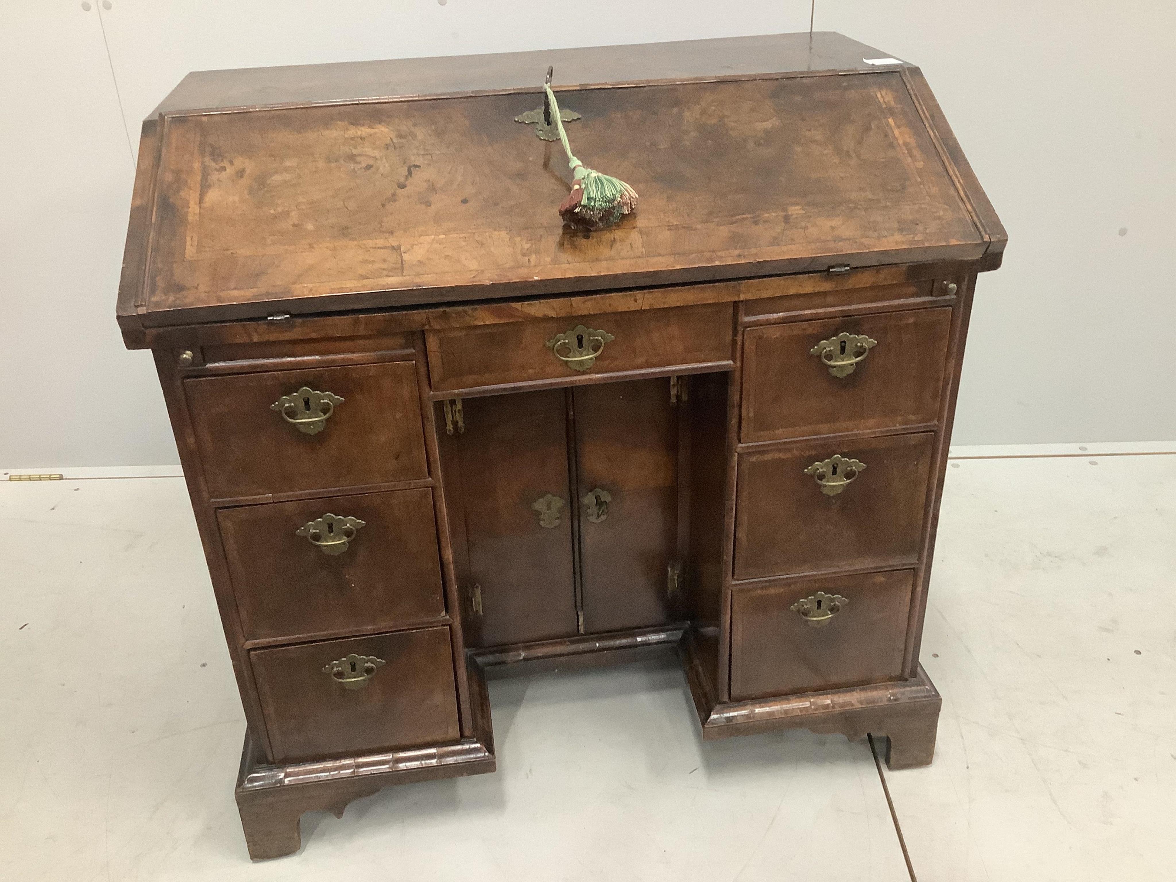 A rare William III walnut and featherbanded kneehole bureau, c.1700, with kneehole underframe, width 91cm, depth 55cm, height 88cm. Purchased from Mallett & Son of New Bond Street, 25th January 1954 for £270. Condition -